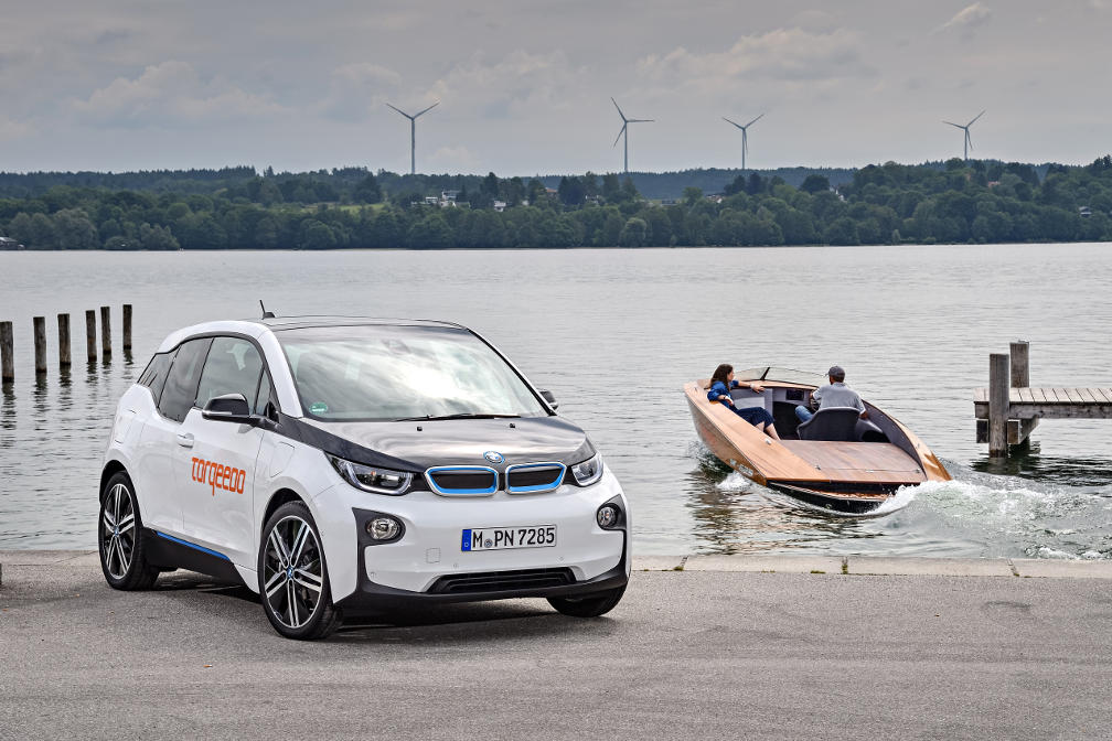 A BMW i3 and an electric boat